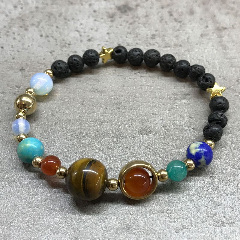 Armband av Lavasten - Guld Solsystemet